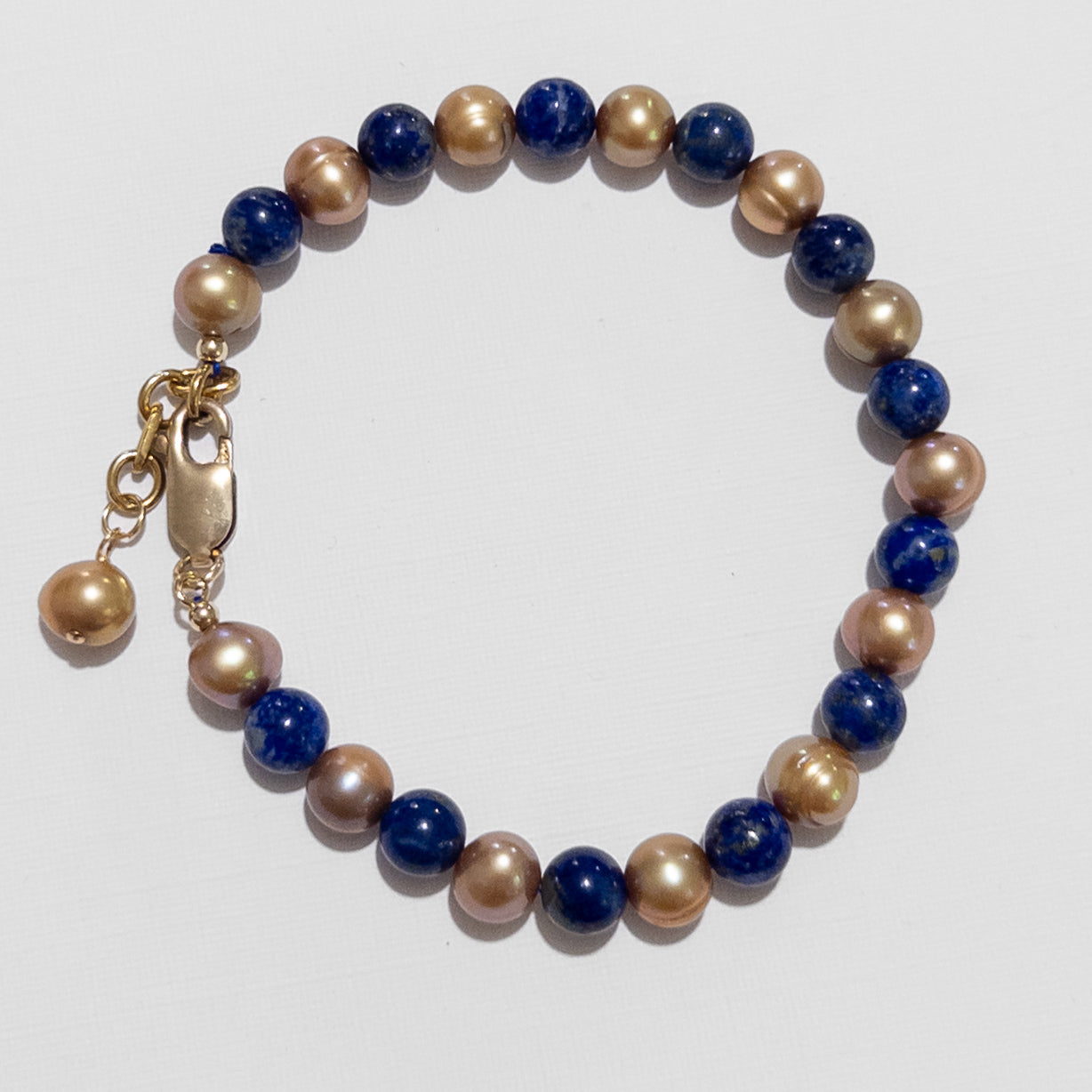 ulsera de Lapislázuli y Perlas Doradas